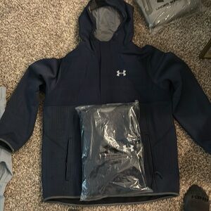 One Navy Blue Under Armour Storm Jacket size XXL.